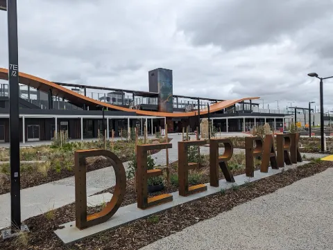 The forecourt of Deer Park station, with large DEER PARK letters